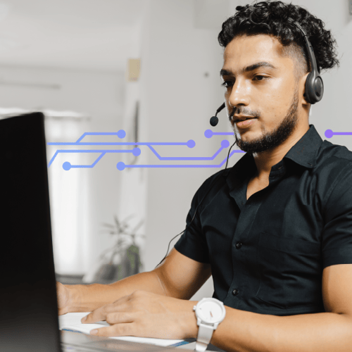 Photo of a male contact center agent wearing a headset and working at his computer. In the background, a series of blue icons representing digital tech run across the frame.