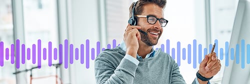 Image of male customer agent wearing a headset and talking on a call