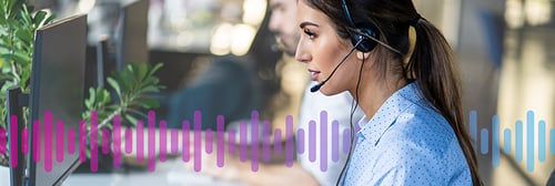 Image of female customer agent wearing a headset on a call in front of a computer monitor