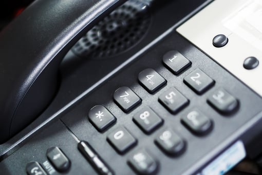 Close up of phone dialpad An IP Phone in soft light