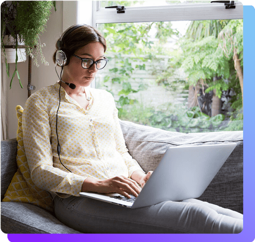 Girl working from home on a headset and laptop