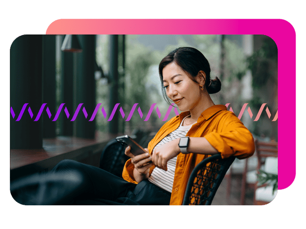 Image of a Woman sitting on a bench using phone