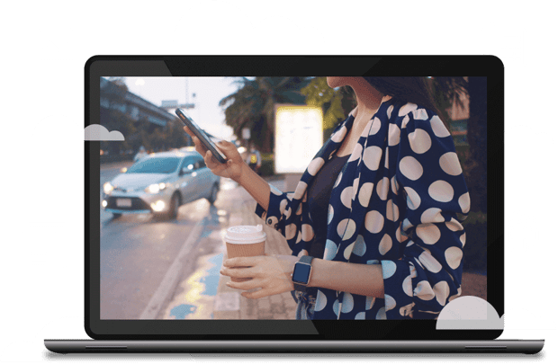 Laptop image with a still frame of a woman using a mobile app and laptop
