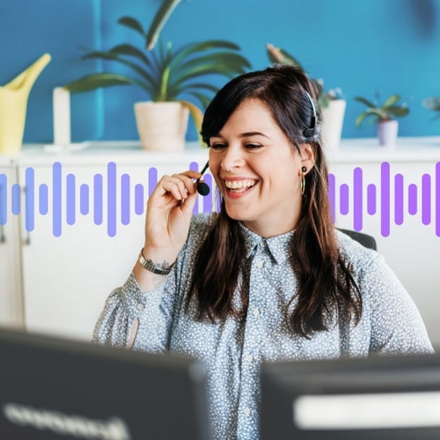 UC Warm Transfer Blog Header Photo of a smiling call center agent talking to customer on her headset as she prepares to make a warm transfer