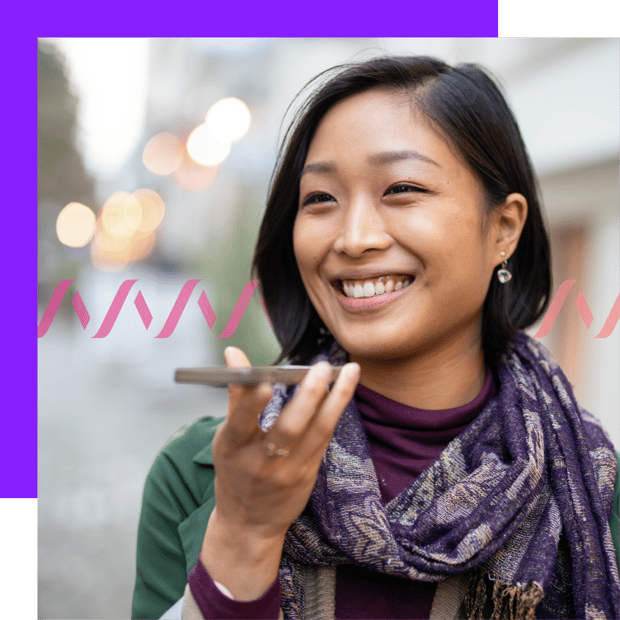 What are Comms APIs header Image of a smiling woman holding up a cell phone, indicating she's on a call