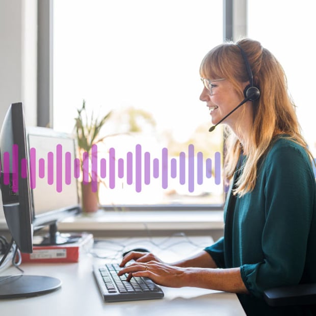 CC-Revenue-Generator-Blog Image of a woman wearing a phone headset and looking at a computer.