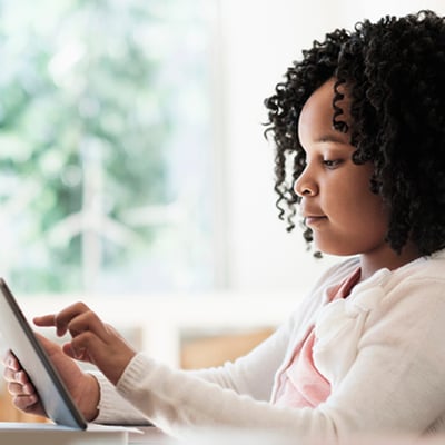 Video in Education young girl using a tablet at home