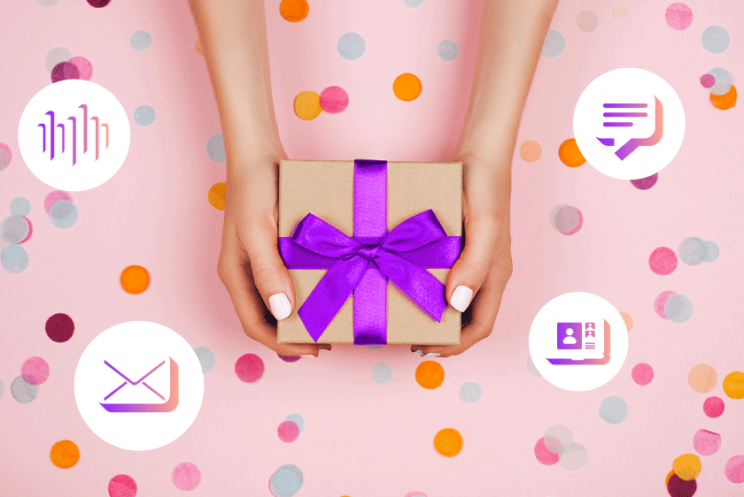 Photo of two hands holding a package in front of a colorful background. The box is wrapped in a pretty bow.
