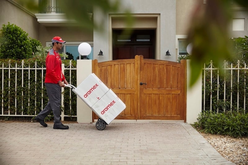 Aramex delivery person delivering packages
